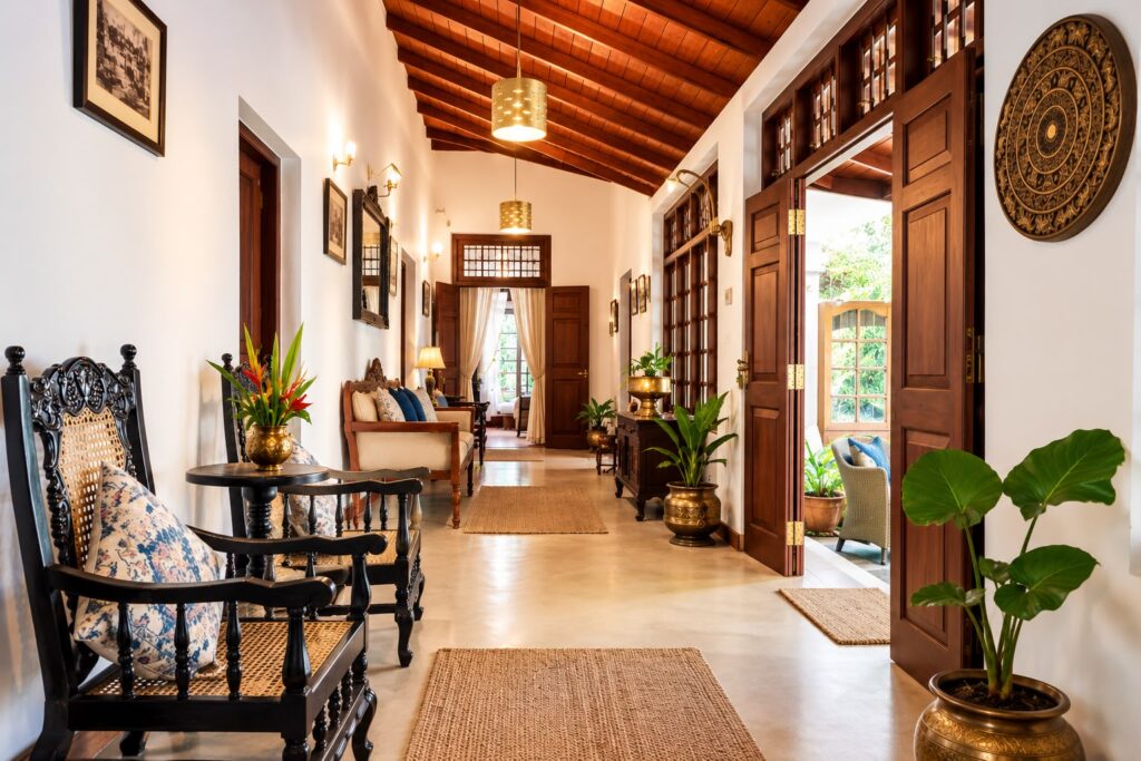 The colonial corridor with timber ceiling, arched doors and antique furniture